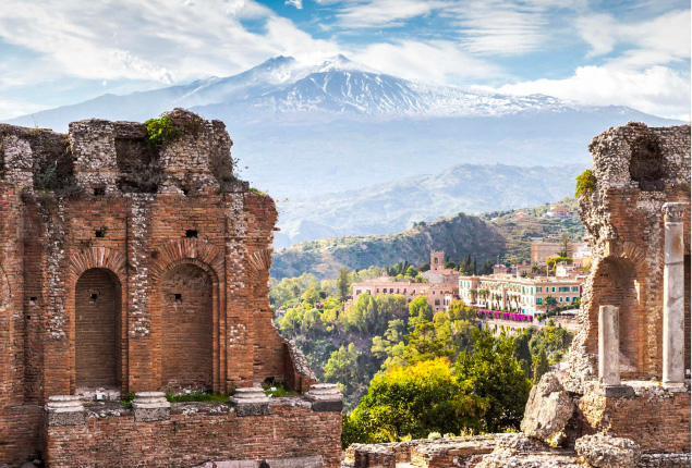 Etna seen from the ruins of the Greek Theater in Taormina