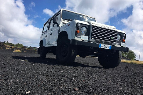 jeep on the lava land of the Etna volcano