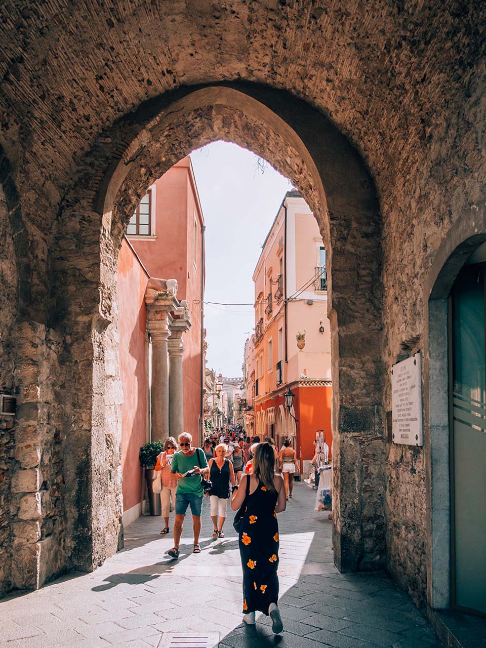 People walking in the main street of Taormina