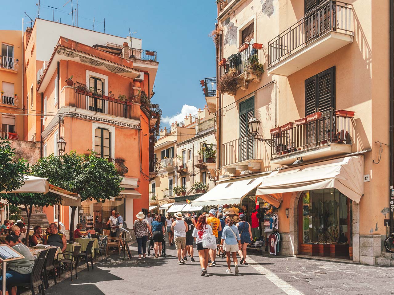 People walking in the main street of Taormina