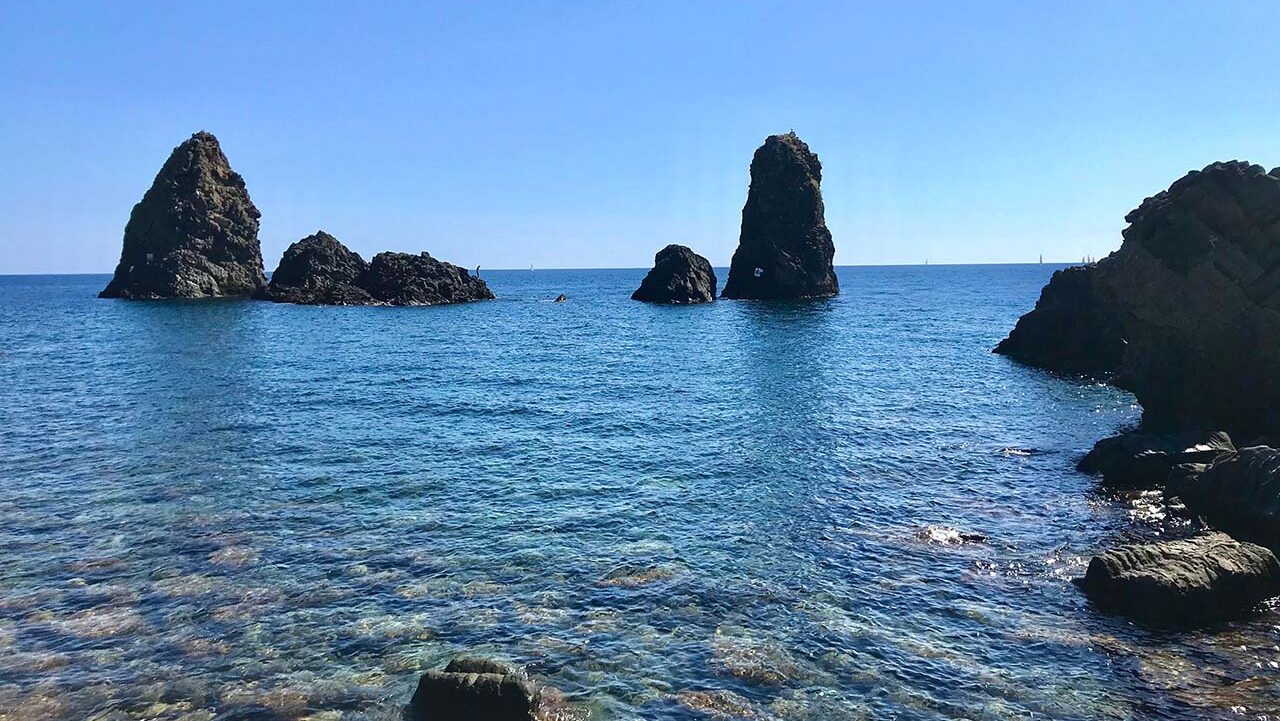 stacks of Acitrezza in the Sicilian sea